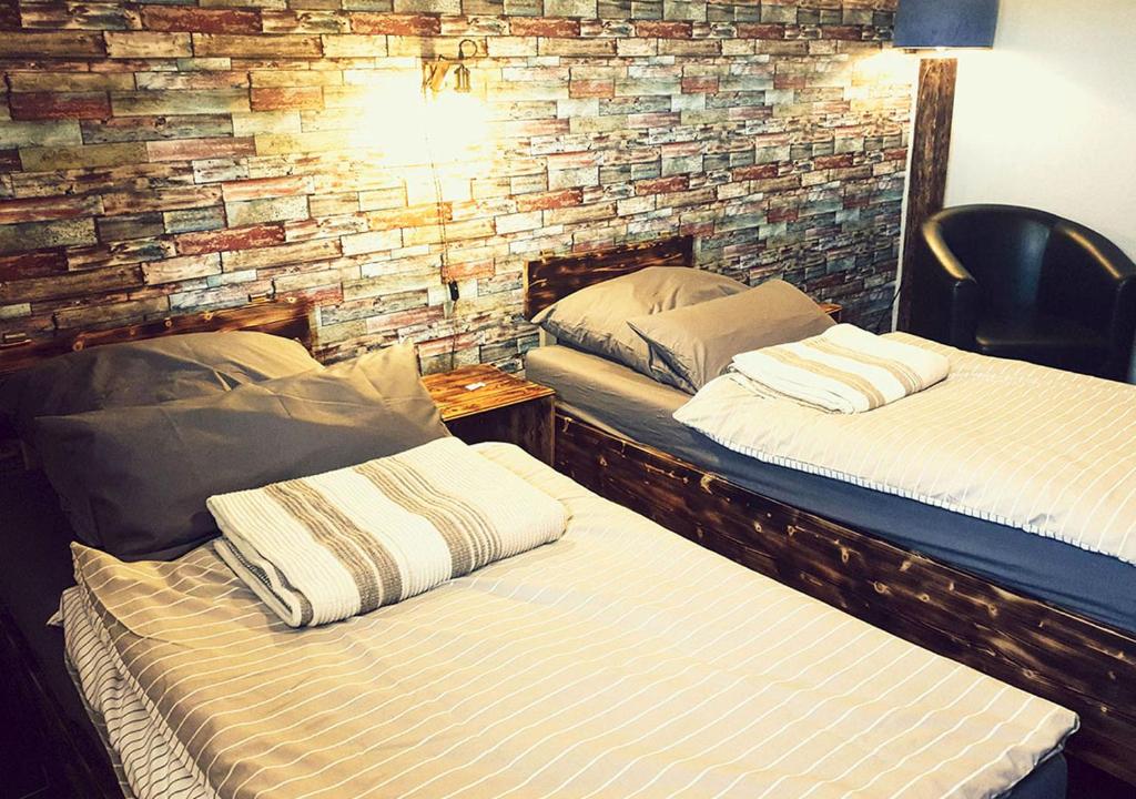 Postel nebo postele na pokoji v ubytování Hotel Geismarburg