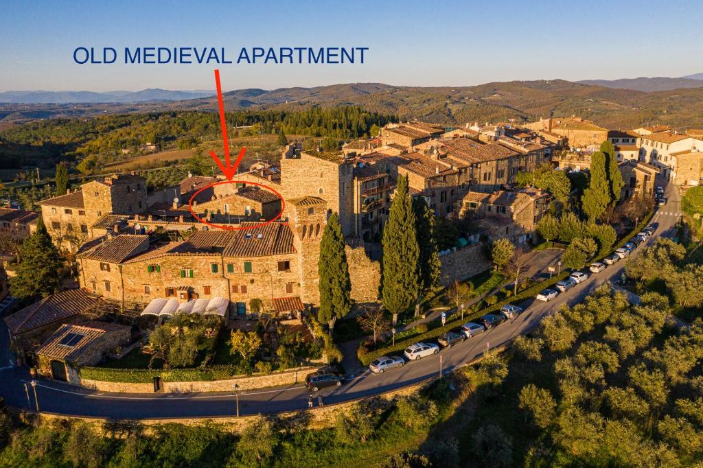 an aerial view of an old mediterranean apartment at old medieval apartment in San Donato in Poggio