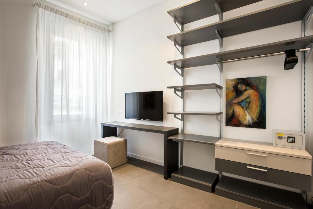Televízia a/alebo spoločenská miestnosť v ubytovaní Residenza Fontanella Barberini by Spanish Steps