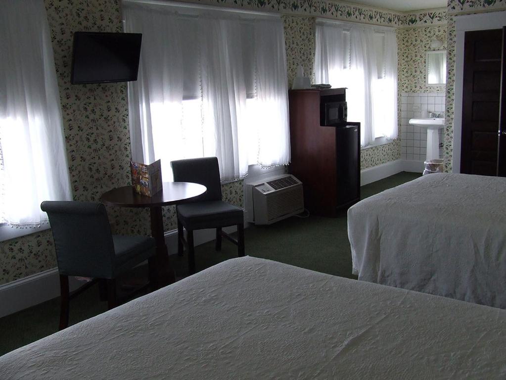 Postel nebo postele na pokoji v ubytování Atlantic Hotel, Inc