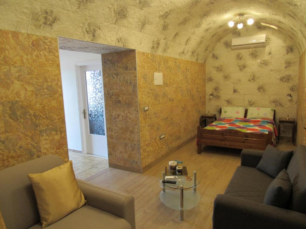 A bed or beds in a room at Pitini Sevasti house