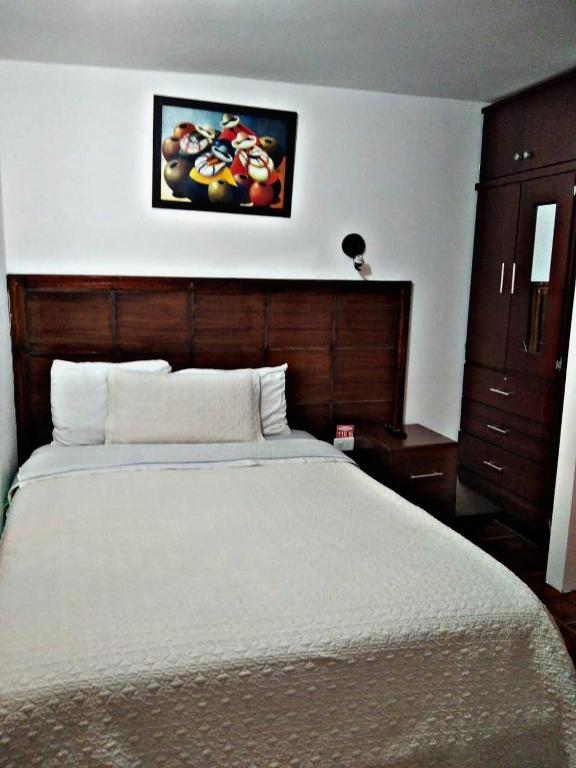 Postel nebo postele na pokoji v ubytování Hostal Mariscal Sucre