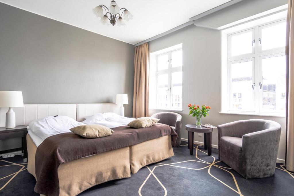 Postel nebo postele na pokoji v ubytování Hotel Dania