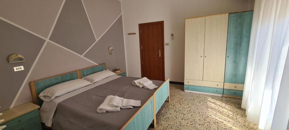 Postel nebo postele na pokoji v ubytování Hotel Astoria