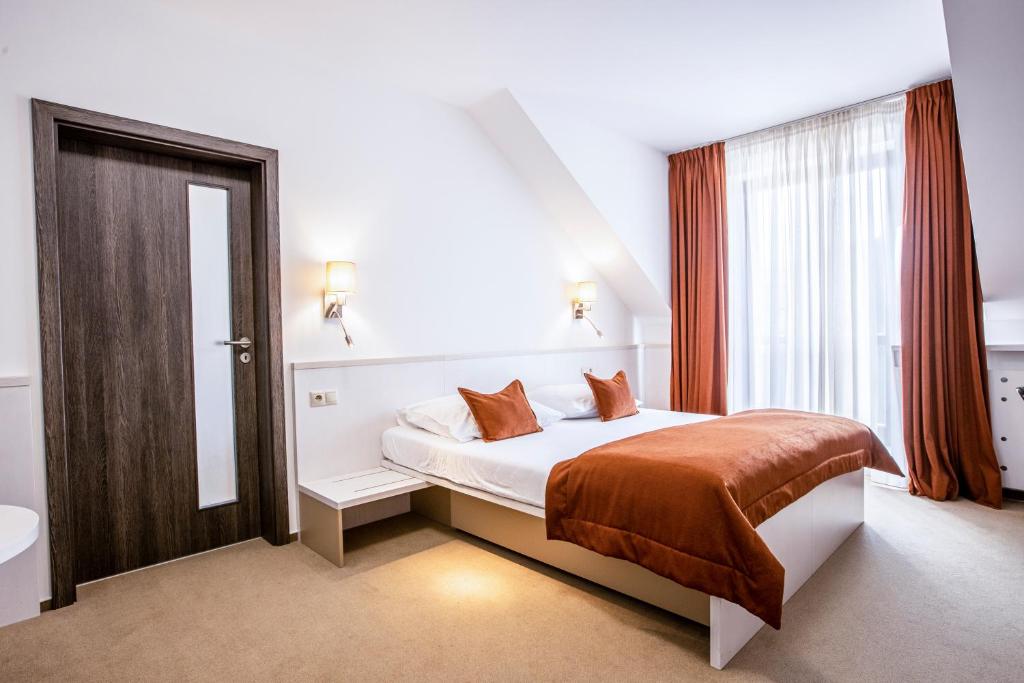 Postel nebo postele na pokoji v ubytování Hotel Olberg