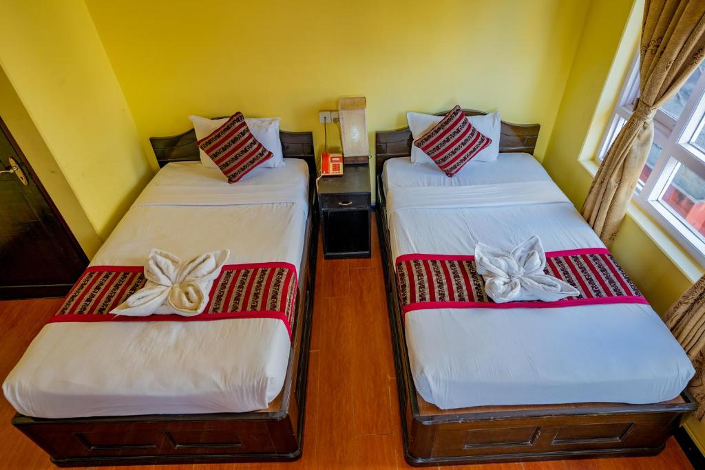Katil atau katil-katil dalam bilik di Hotel Bougainvillea