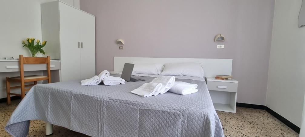 Postel nebo postele na pokoji v ubytování Hotel Astoria