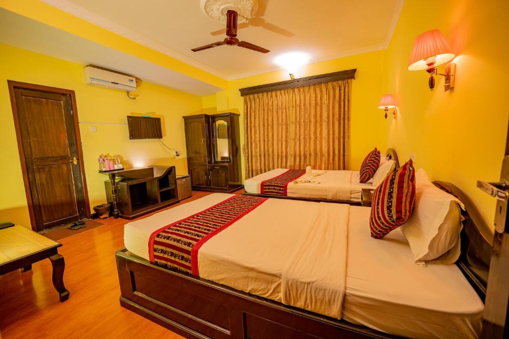 Katil atau katil-katil dalam bilik di Hotel Bougainvillea