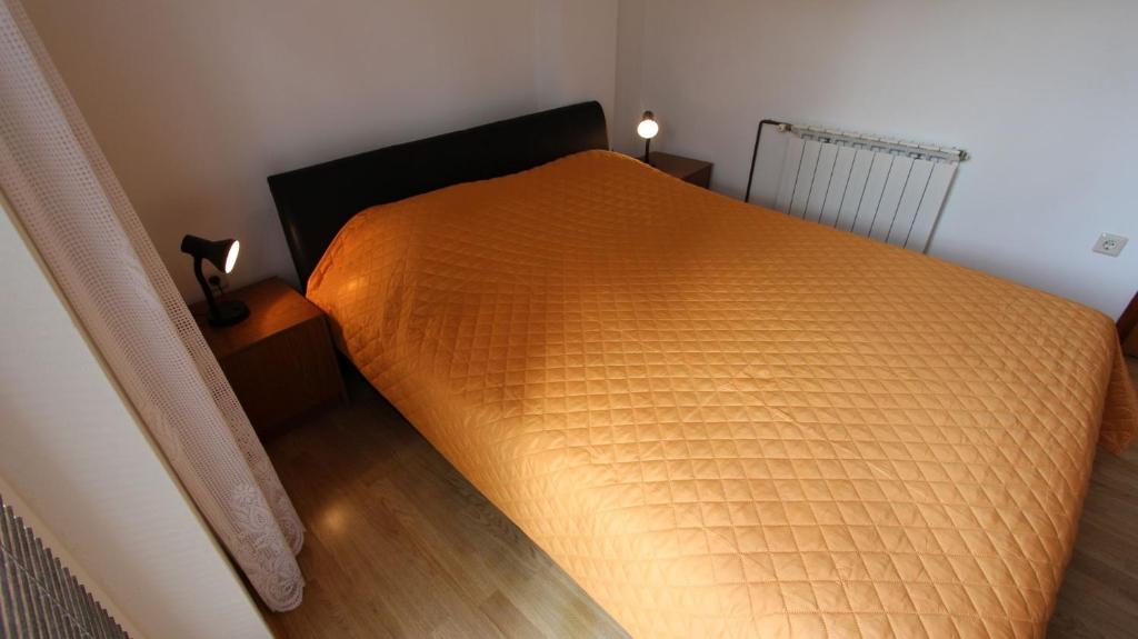Postel nebo postele na pokoji v ubytování Apartments Gržetić