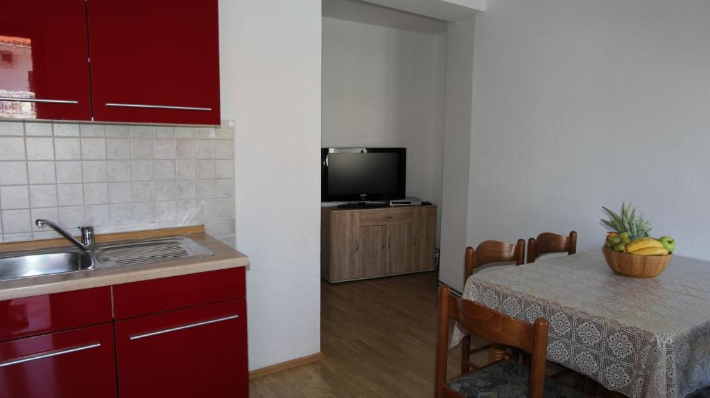 Kuchyň nebo kuchyňský kout v ubytování Apartments Gržetić