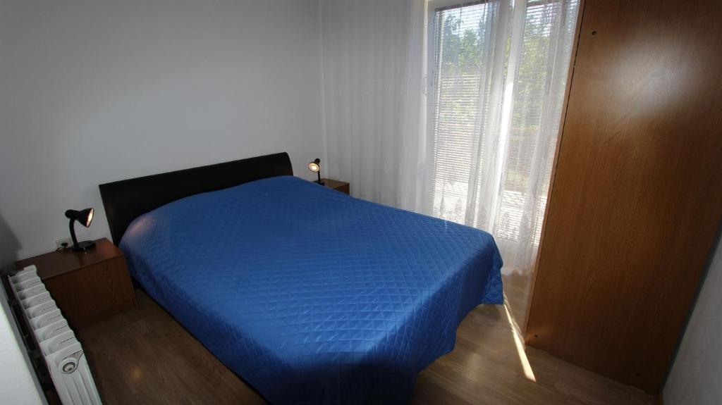 Postel nebo postele na pokoji v ubytování Apartments Gržetić