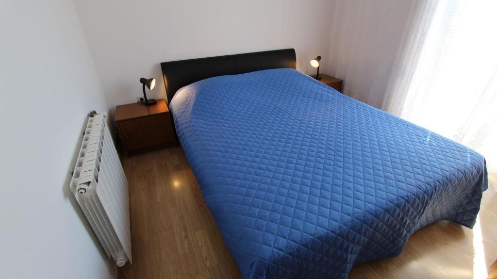 Postel nebo postele na pokoji v ubytování Apartments Gržetić