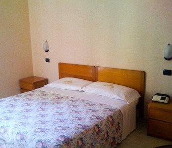 Postel nebo postele na pokoji v ubytování Hotel Aurora