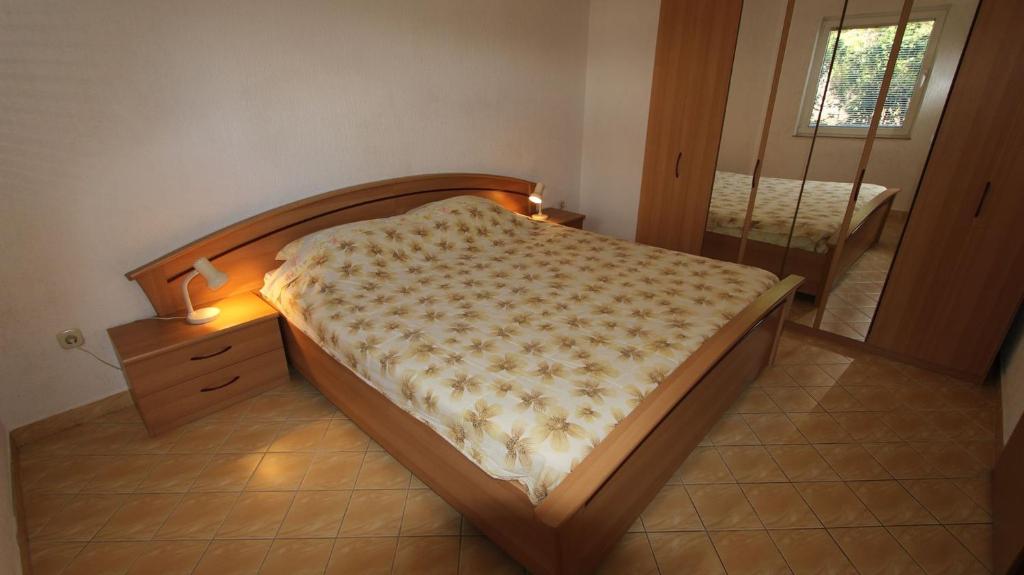 Postel nebo postele na pokoji v ubytování Apartments Gržetić