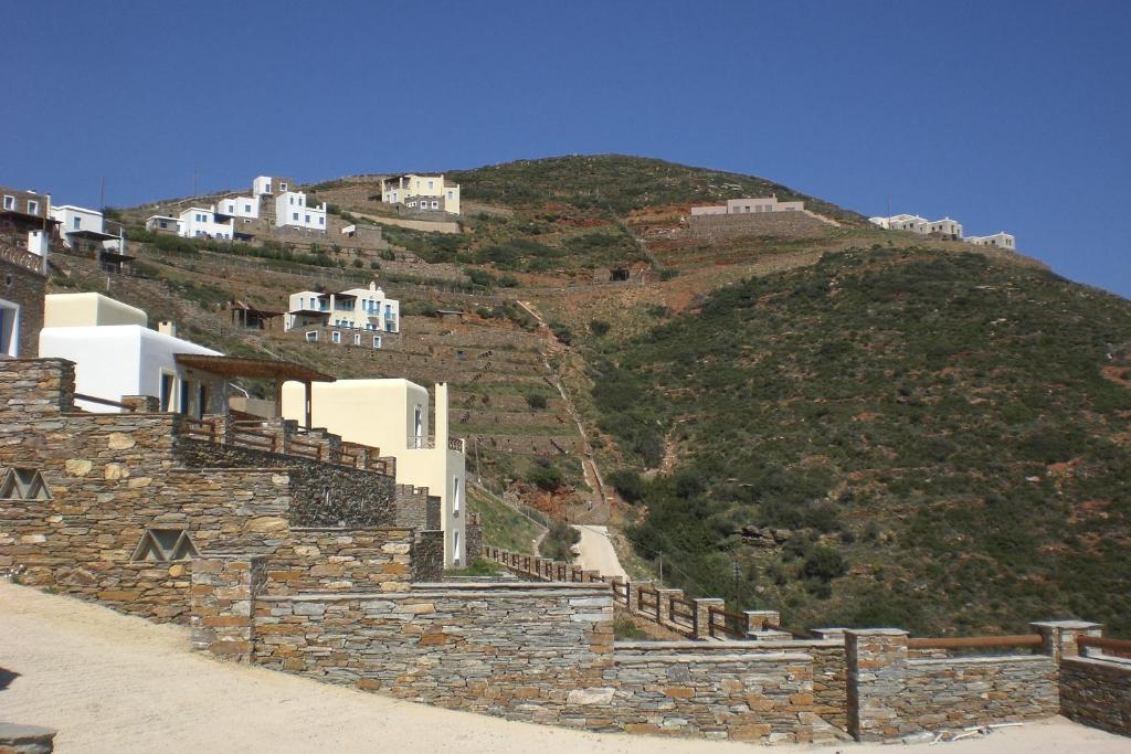 a group of buildings on top of a hill at Monolithos Villas in Kipri