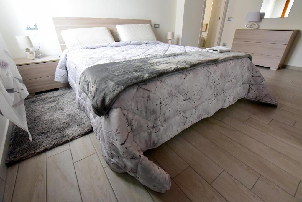 Łóżko lub łóżka w pokoju w obiekcie B&B La Genuina