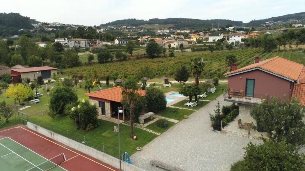 an aerial view of a house with a tennis court at Quinta Lama de Cima in Fafe