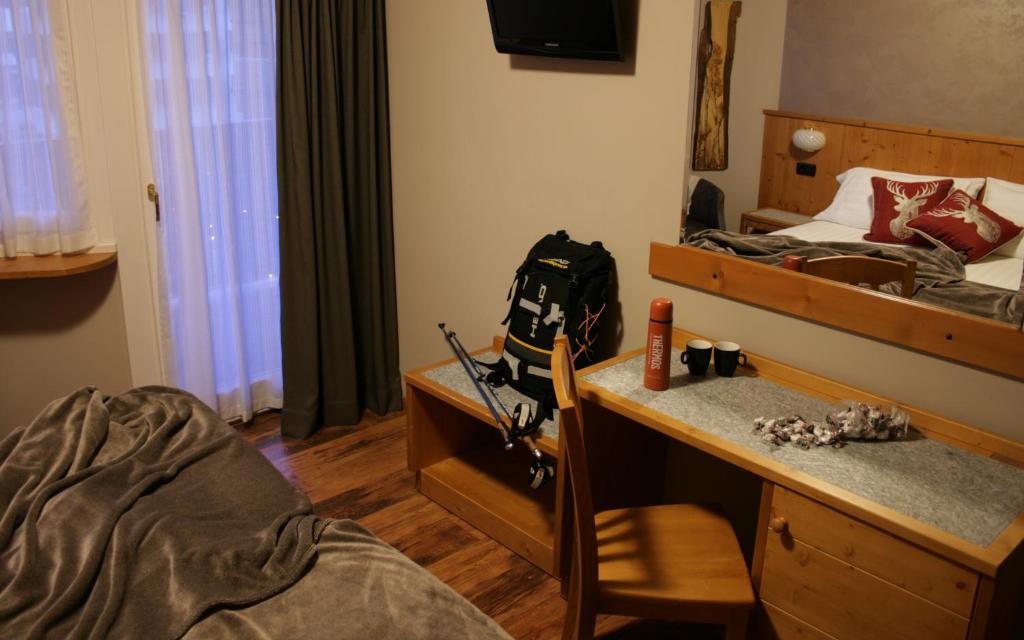 Postel nebo postele na pokoji v ubytování Hotel Larice Bianco