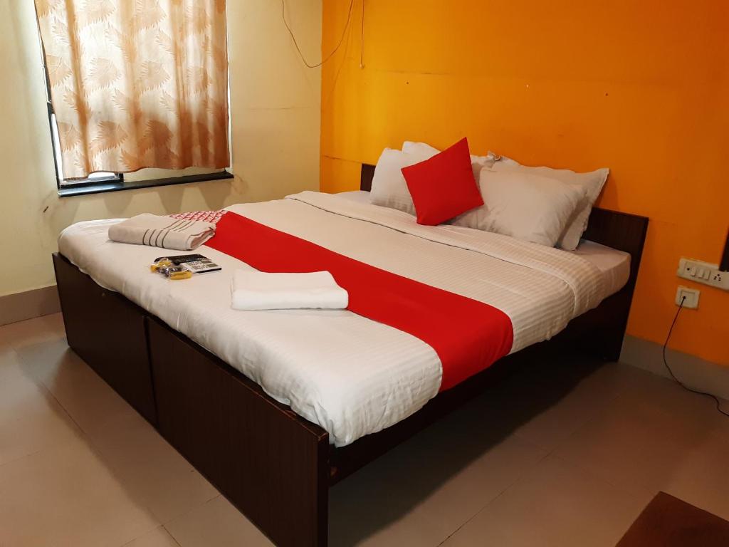Postel nebo postele na pokoji v ubytování Hotel Akash inn