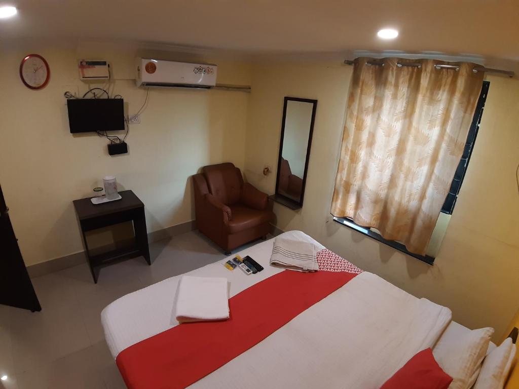 Postel nebo postele na pokoji v ubytování Hotel Akash inn
