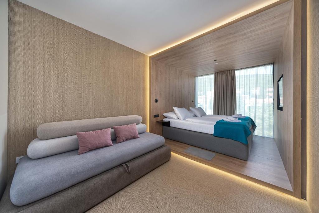 Een bed of bedden in een kamer bij Hotel Katarina