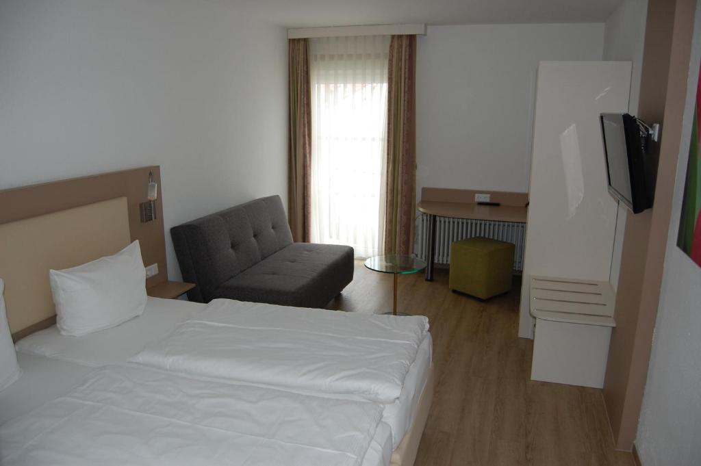 Postel nebo postele na pokoji v ubytování Hotel Feyrer