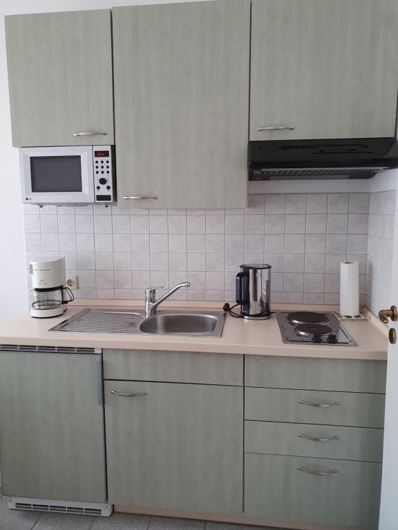 Kuchyň nebo kuchyňský kout v ubytování Hotel Sophien-Café