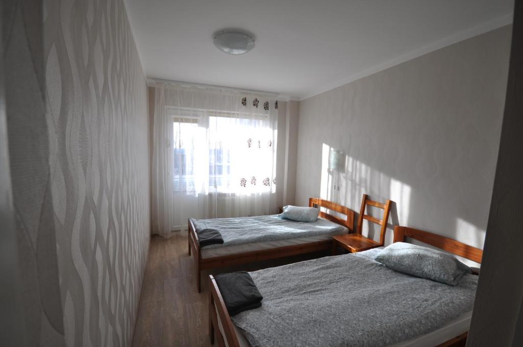 Cama o camas de una habitación en Apartamenti Apakšstacija