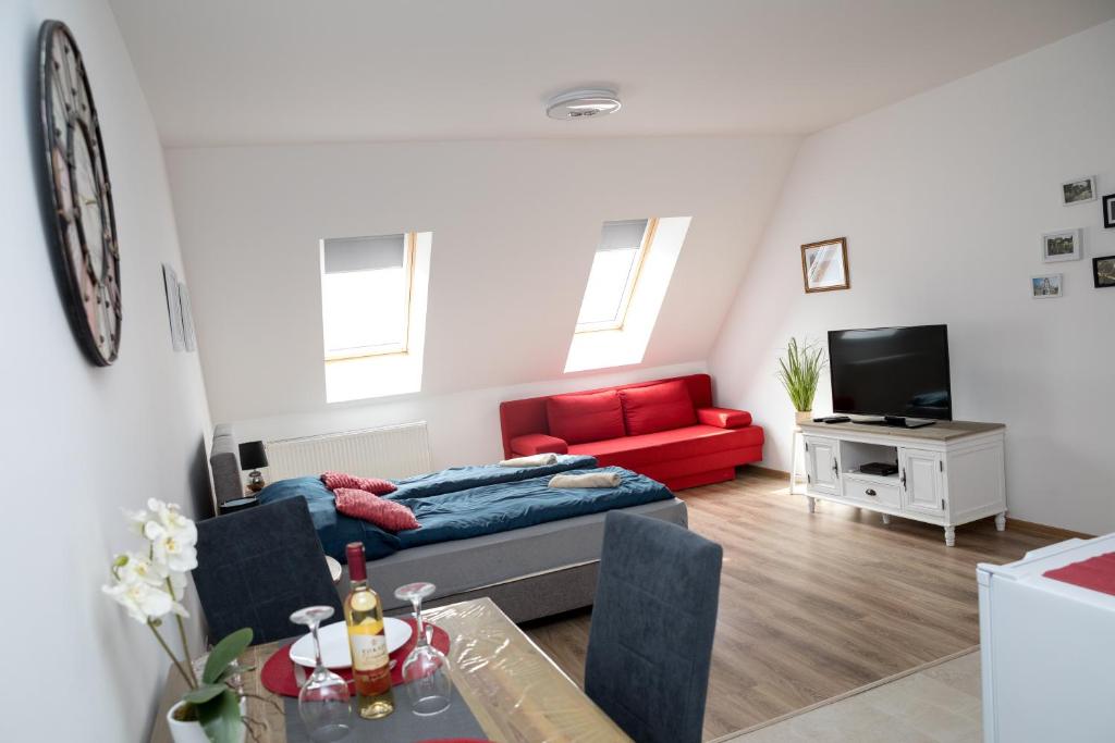 TV a/nebo společenská místnost v ubytování Kossuth Apartmanház
