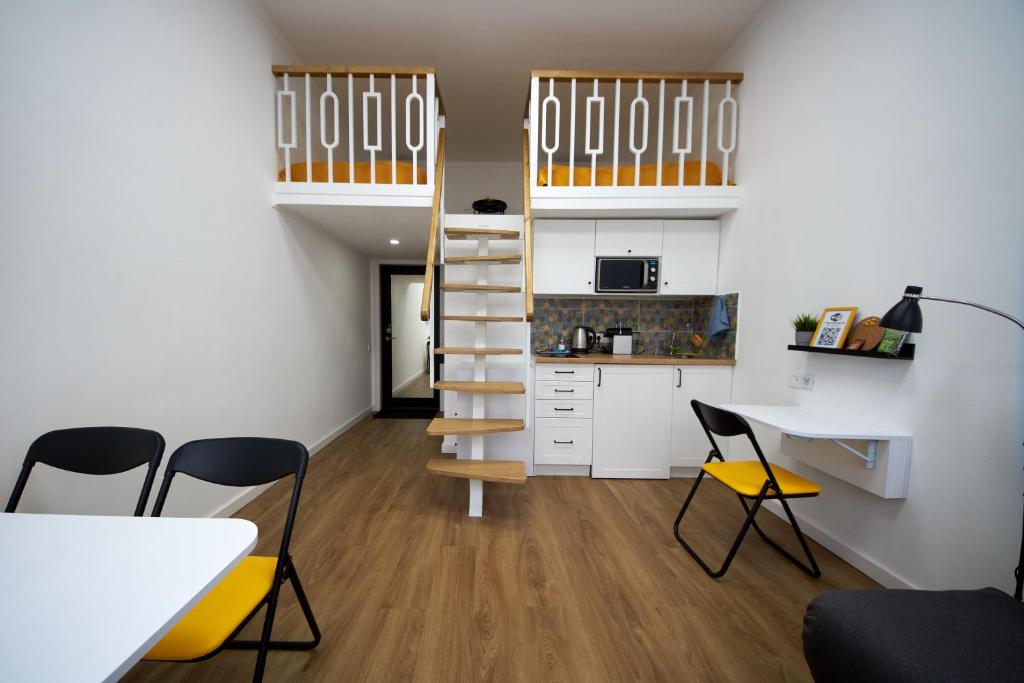 A kitchen or kitchenette at Затишні дворівневі смарт апартаменти