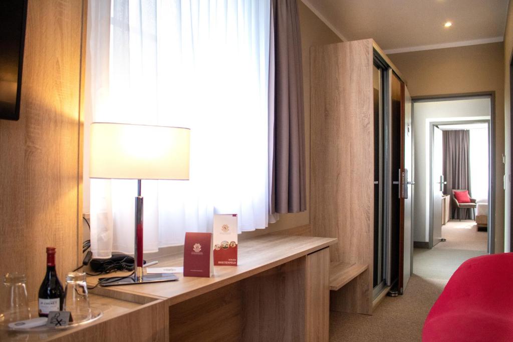 Postel nebo postele na pokoji v ubytování Schloss Breitenfeld Hotel & Tagung