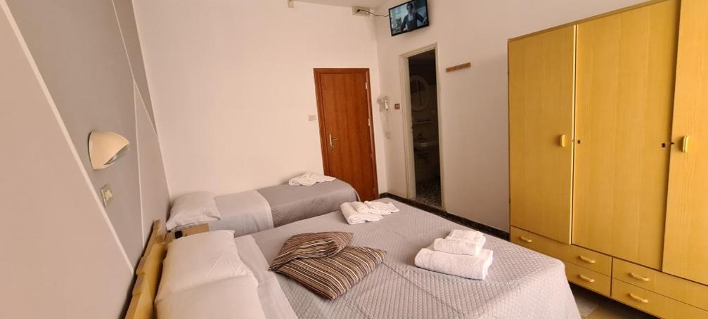 Postel nebo postele na pokoji v ubytování Hotel Astoria