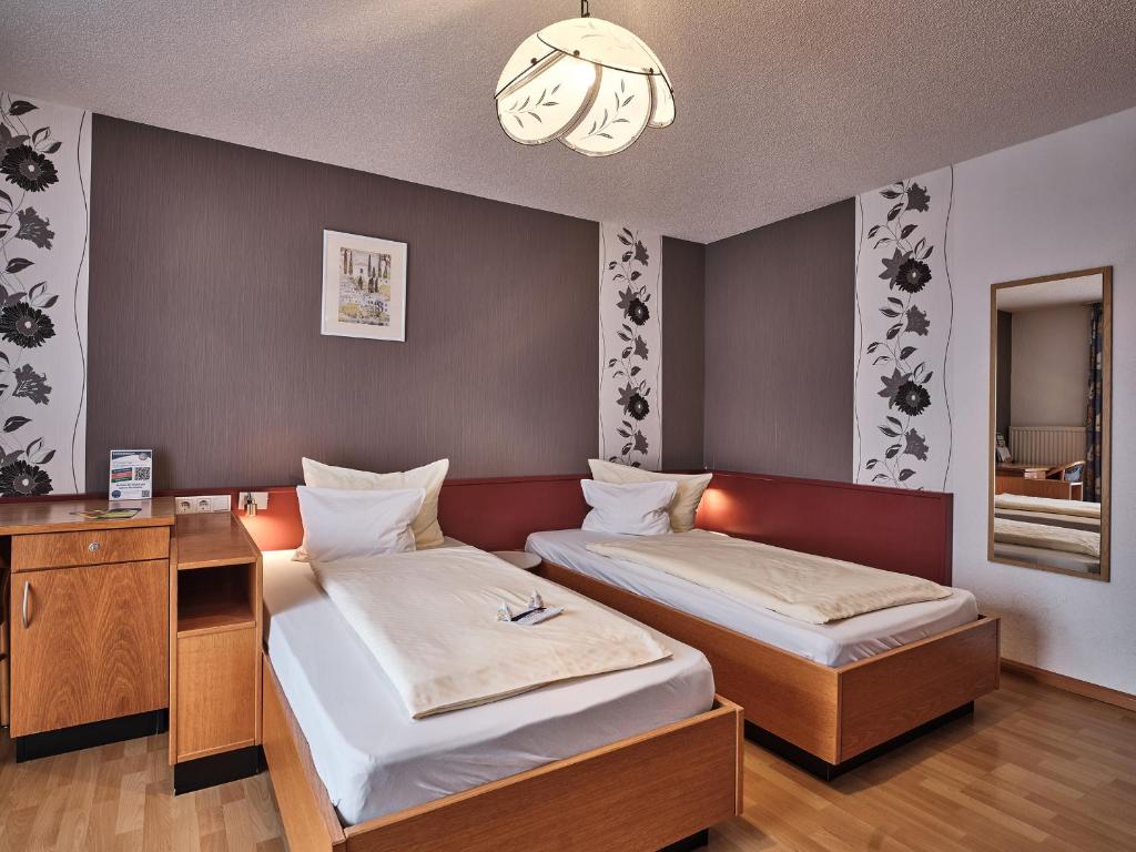 Postel nebo postele na pokoji v ubytování TIPTOP Hotel am Hochrhein