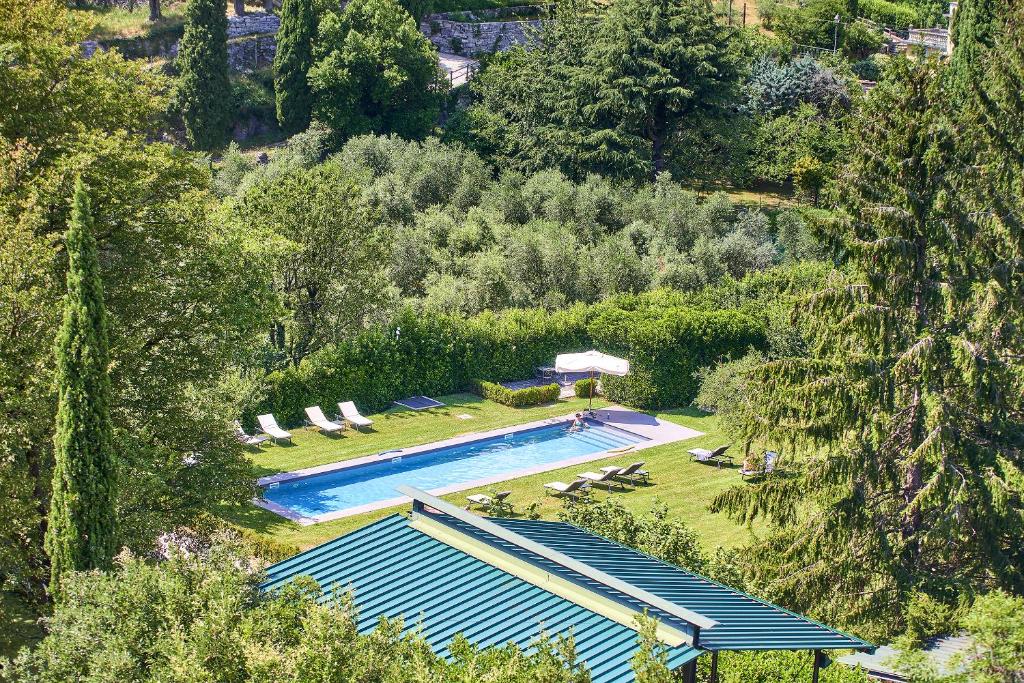 an overhead view of a swimming pool in a garden at Castello di Vezio in the Village in Varenna