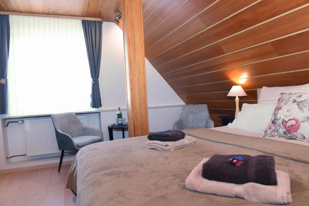 Postel nebo postele na pokoji v ubytování Hotel Wappenhof