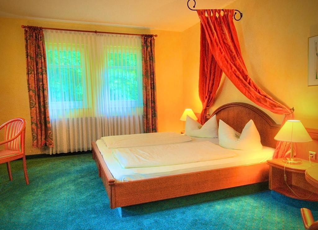 Postel nebo postele na pokoji v ubytování Meister BÄR HOTEL Vogtland
