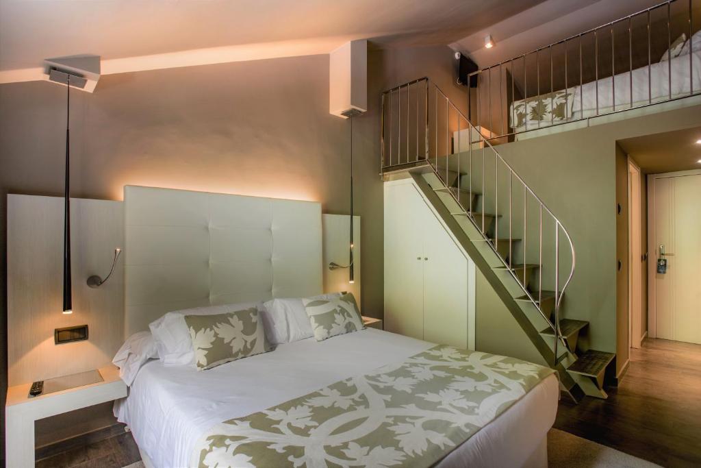Postel nebo postele na pokoji v ubytování Hotel & Spa Xalet Bringue