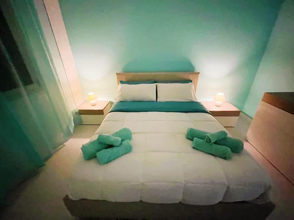 Ένα ή περισσότερα κρεβάτια σε δωμάτιο στο La Risacca Suite