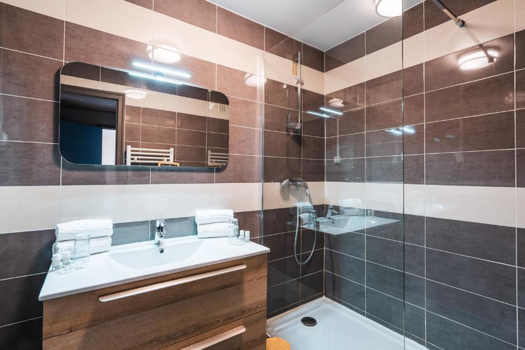Koupelna v ubytování Hotel Les Lutins