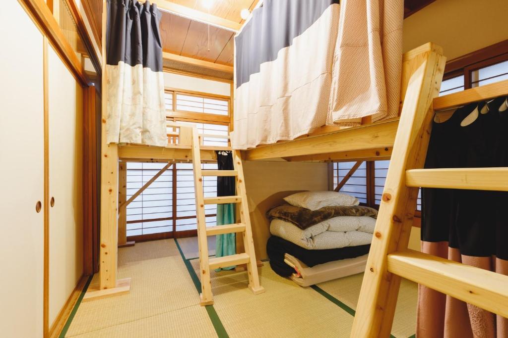 a bunk bed room with two bunk beds at Couch Potato Hostel - Vacation STAY 28455v in Matsumoto