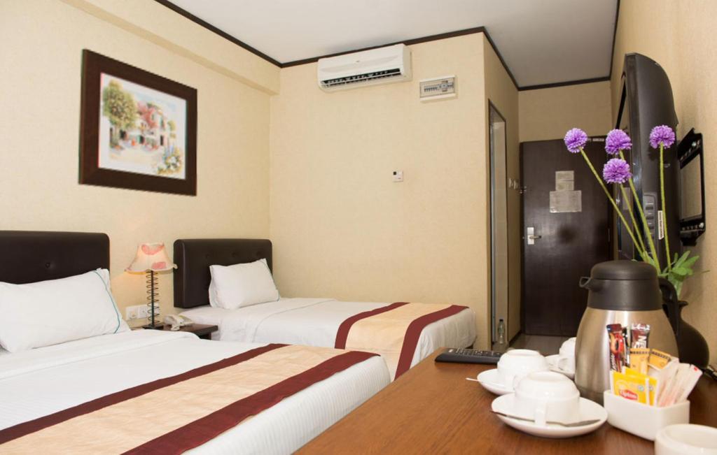 Postel nebo postele na pokoji v ubytování Hotel Vistaria