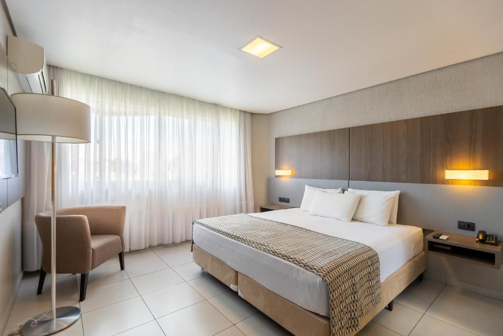 Säng eller sängar i ett rum på Saint Emilion by Atlantica