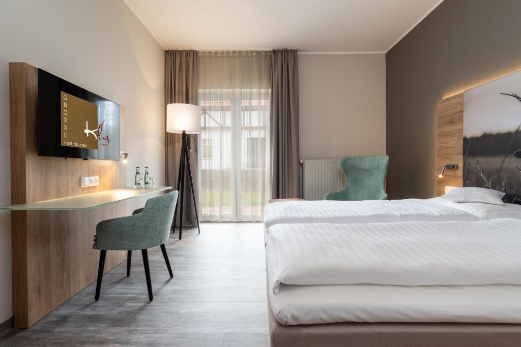 Postel nebo postele na pokoji v ubytování Hotel Grosse Klus