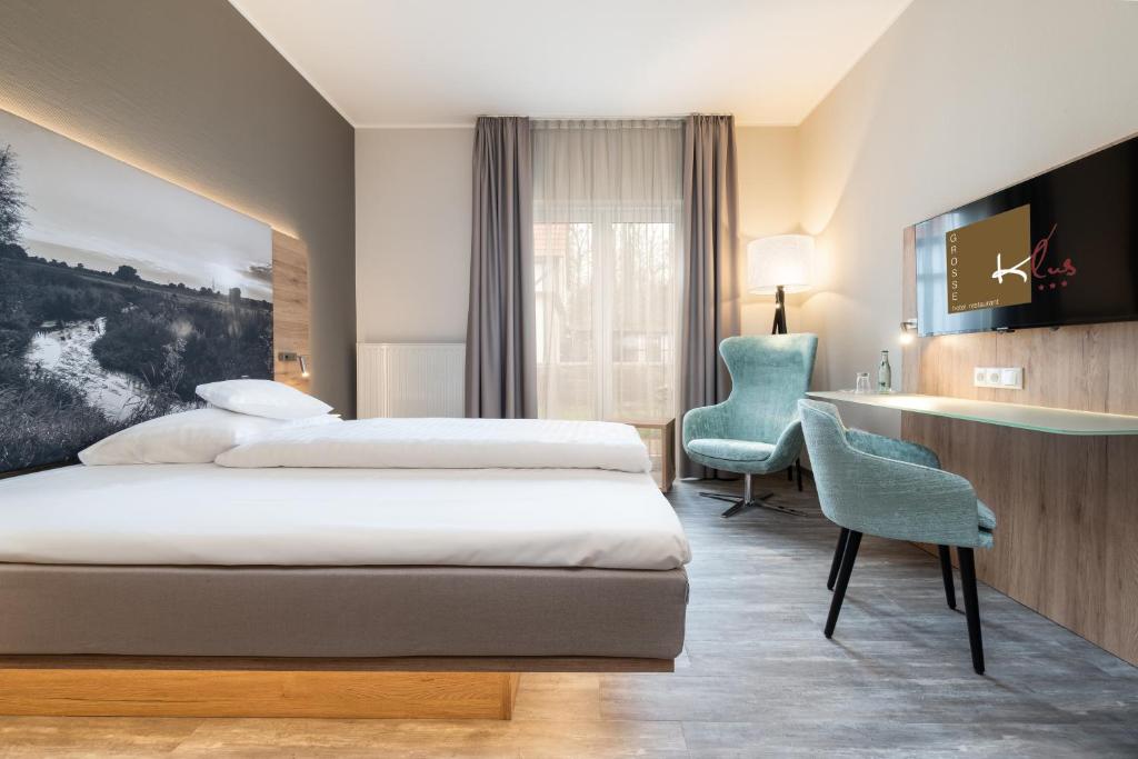 Postel nebo postele na pokoji v ubytování Hotel Grosse Klus