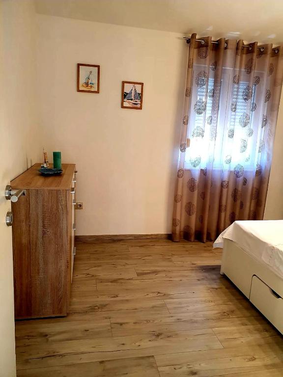 Posteľ alebo postele v izbe v ubytovaní Apartman Alisa