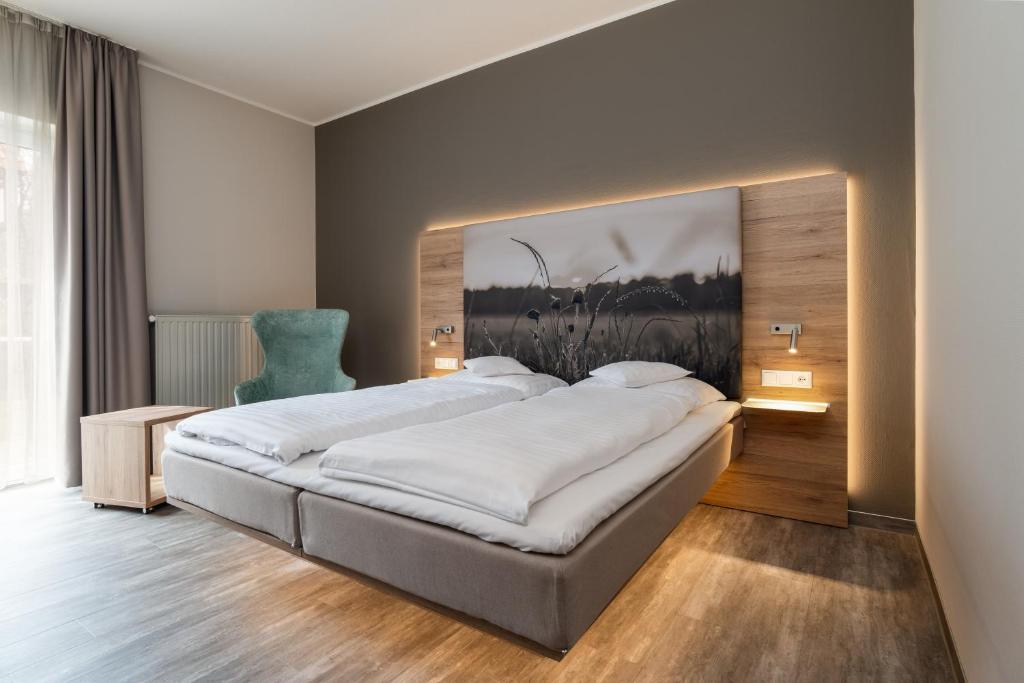 Postel nebo postele na pokoji v ubytování Hotel Grosse Klus