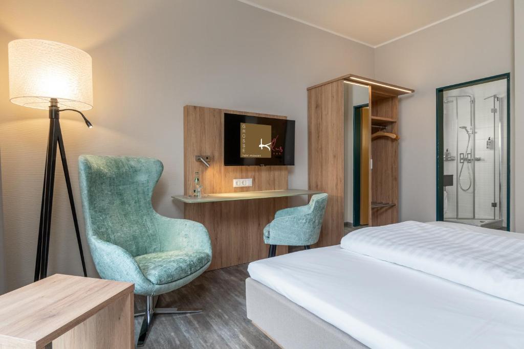 Postel nebo postele na pokoji v ubytování Hotel Grosse Klus
