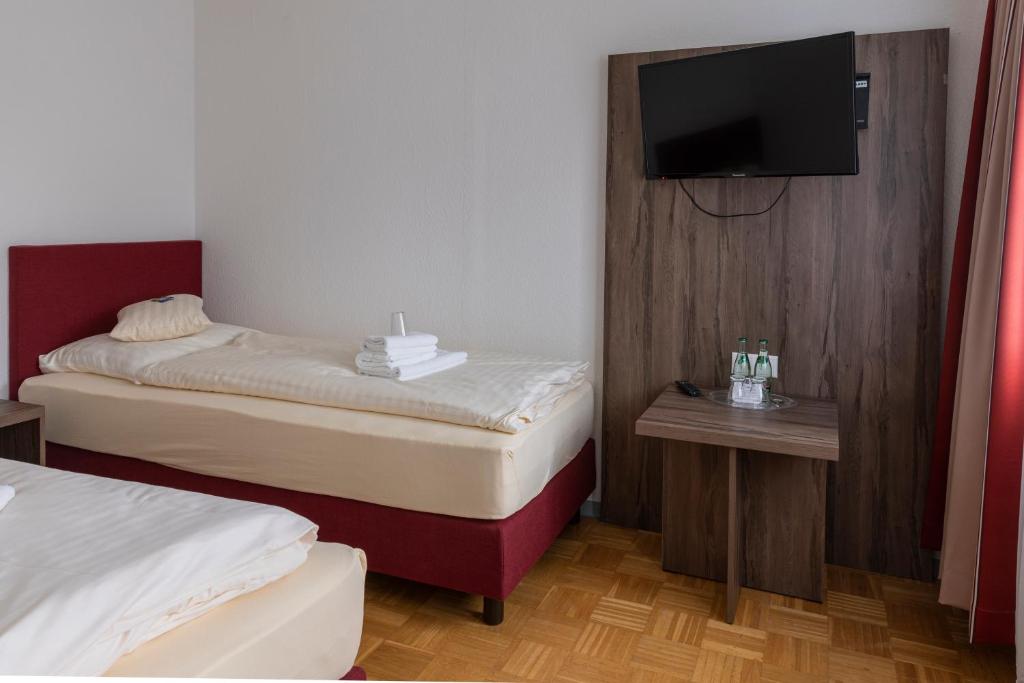 Postel nebo postele na pokoji v ubytování Hotel Grosse Klus
