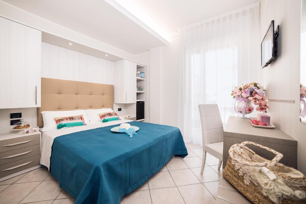 Postel nebo postele na pokoji v ubytování Viva Beach Hotel