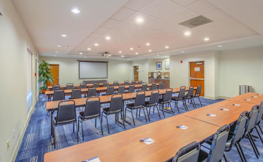 a large room with rows of tables and chairs at Holiday Inn Express Hotel & Suites Gulf Shores by IHG in Gulf Shores